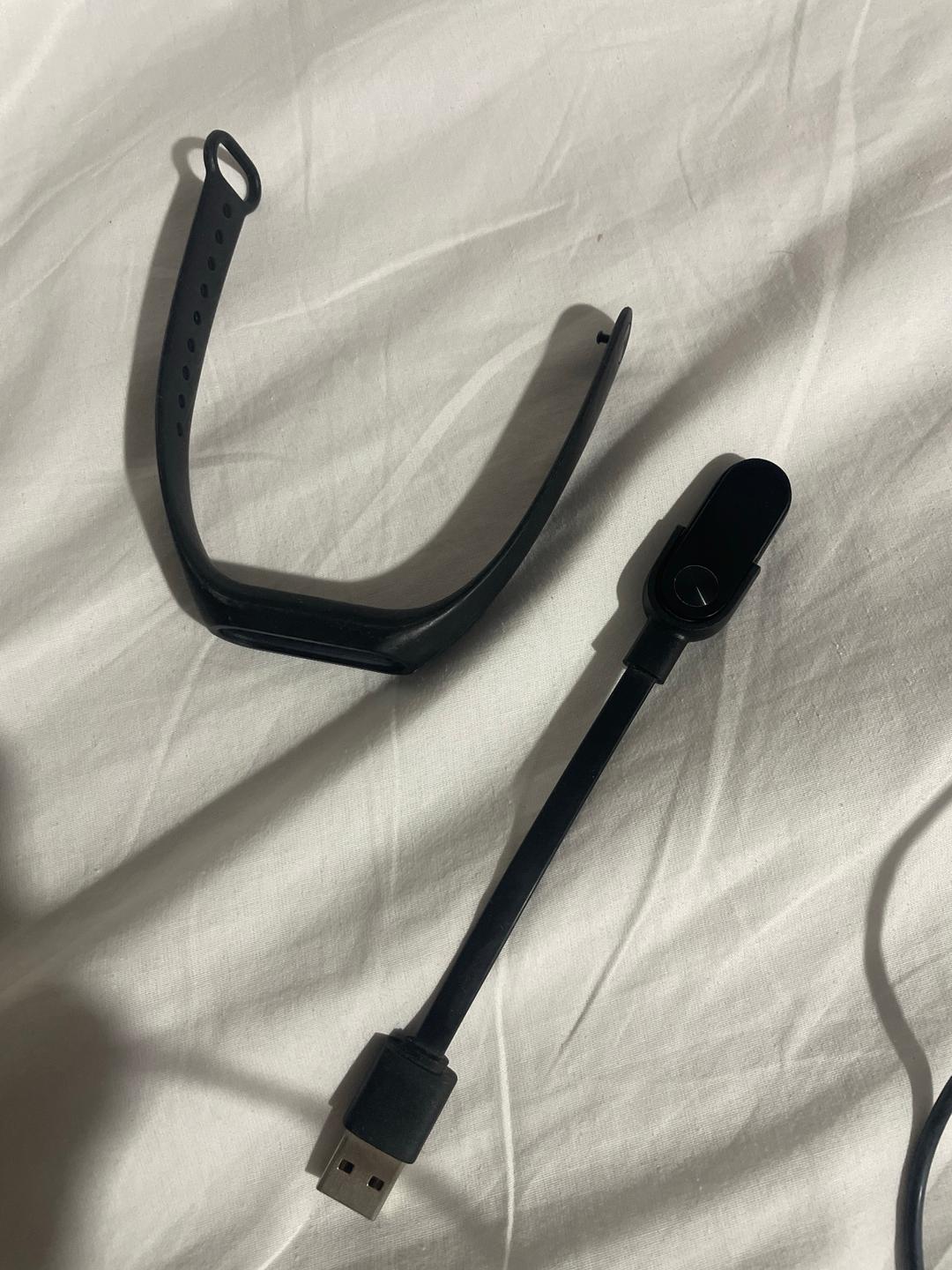 Black Smart Fitness Tracker Band with USB Charging Cable (photo 1 of 3)
