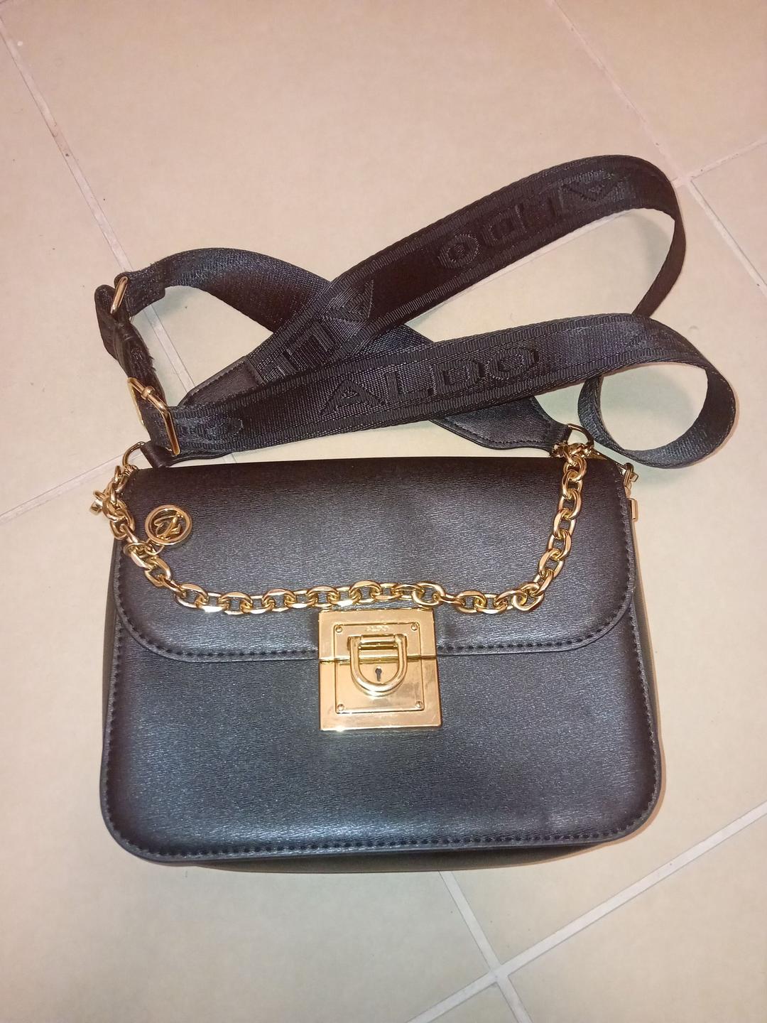ALDO Black Crossbody Bag with Gold Hardware and Chain Accent (photo 1 of 3)