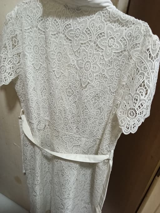 Nited laced dress with beautiful, elegant gold bottens